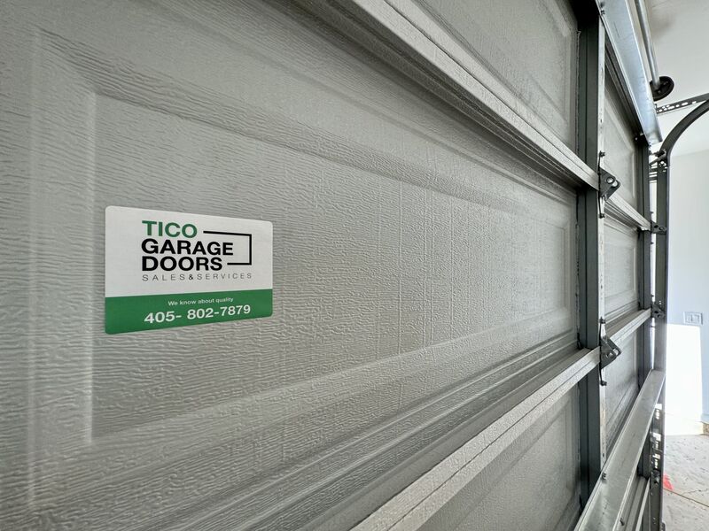 Tico Garage Doors service label on the inside of a new garage door